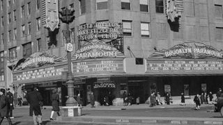 A black and white photo of the exterior of the iconic Brooklyn Paramount Theater. 