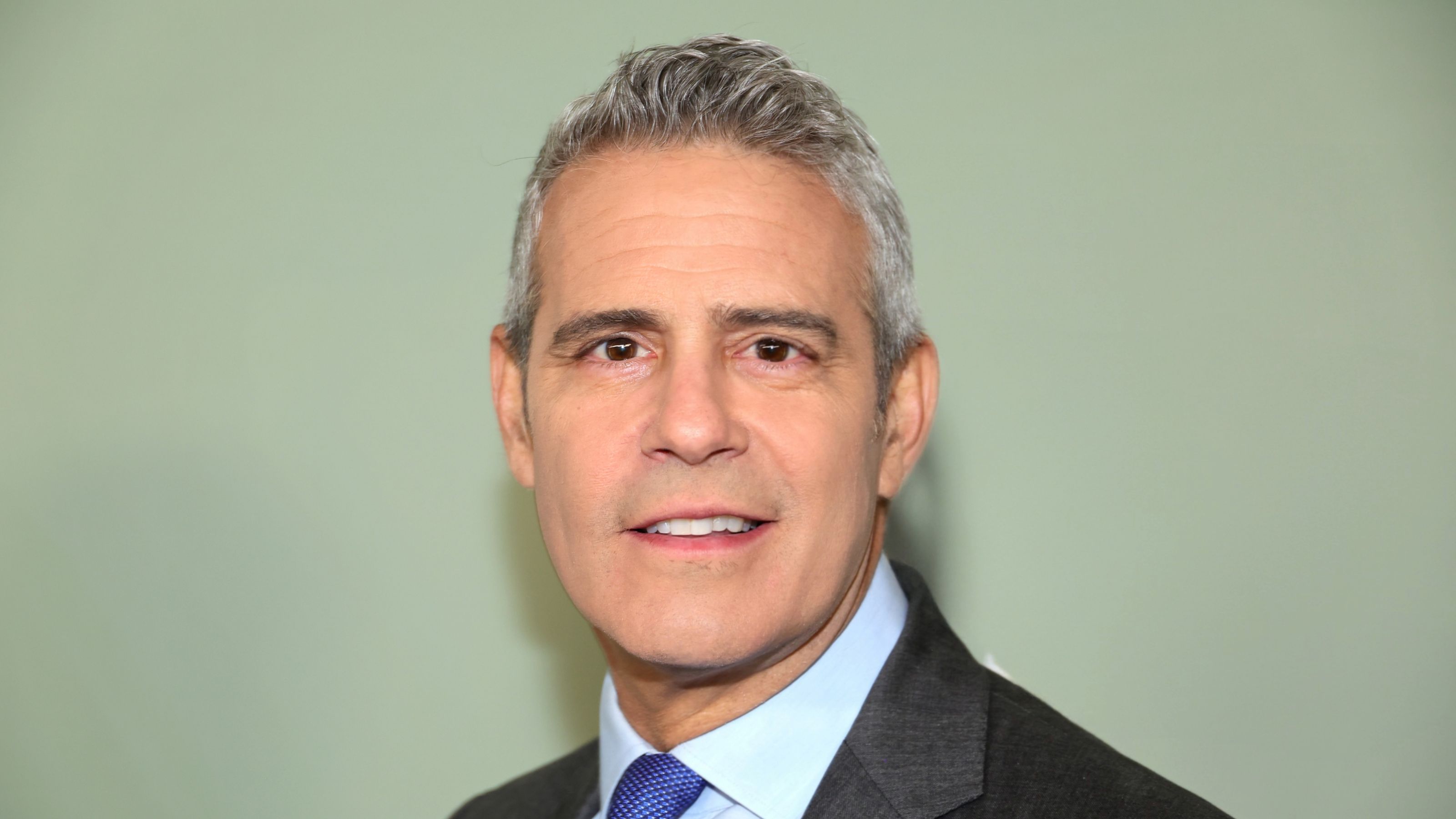andy cohen on a green background