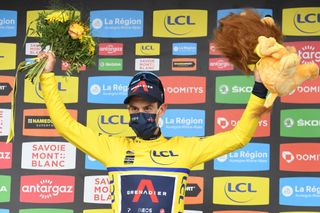 Team Ineos Richie Porte of Australia celebrates his overall leaders yellow jersey on the podium at the end of the seventh stage of the 73rd edition of the Criterium du Dauphine cycling race a 171km between SaintMartinLeVinoux and La Plagne on June 5 2021 Photo by Alain JOCARD AFP Photo by ALAIN JOCARDAFP via Getty Images