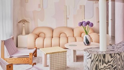 peach living room with curved sofa
