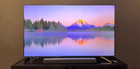 TCL Q7 TV showing colorful landscape onscreen