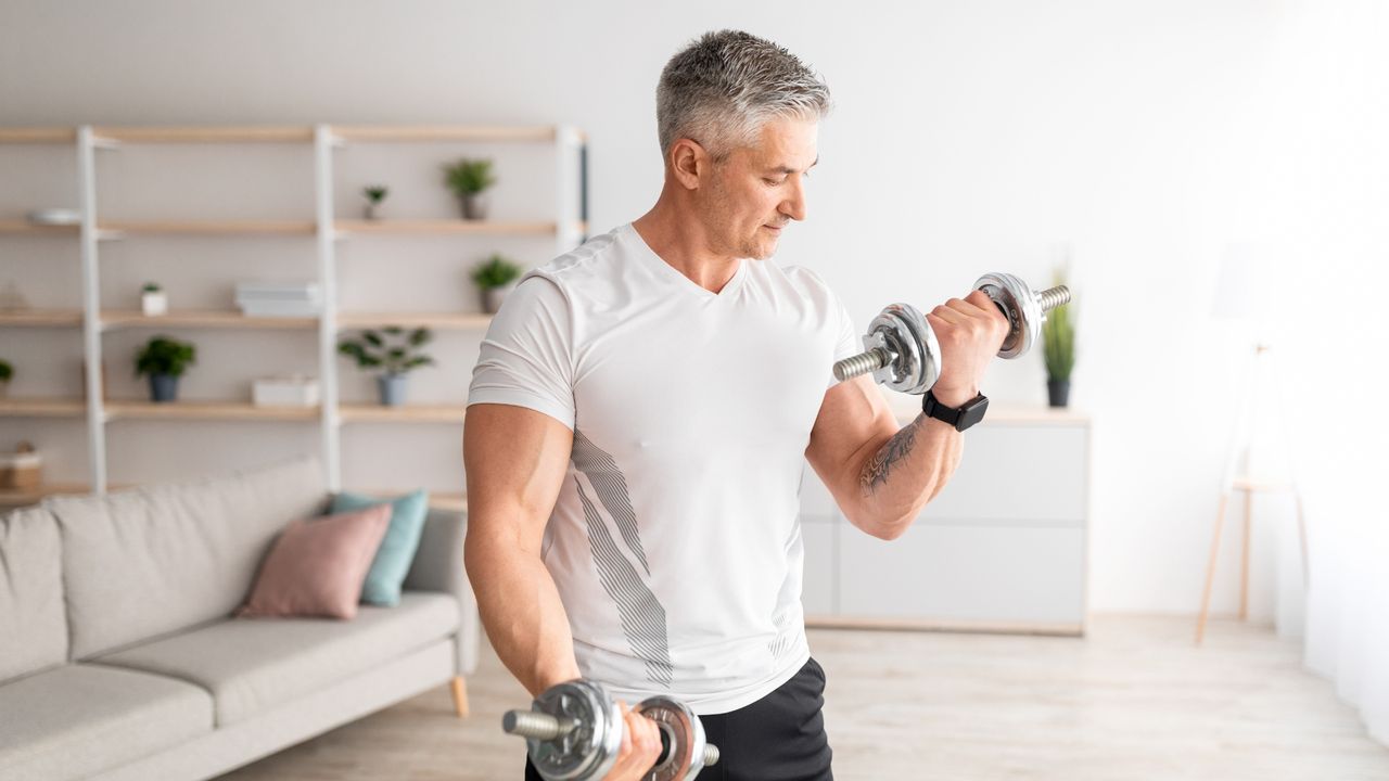 Man performing dumbbell curls