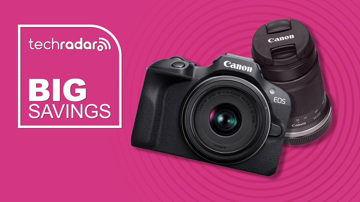 Canon EOS R100 with lens on a pink background with TechRadar big saving text overlay