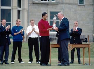 Tiger Woods being presented with his first of three Open Championships in 2000 on the final day at St.Andrews Golf Course.