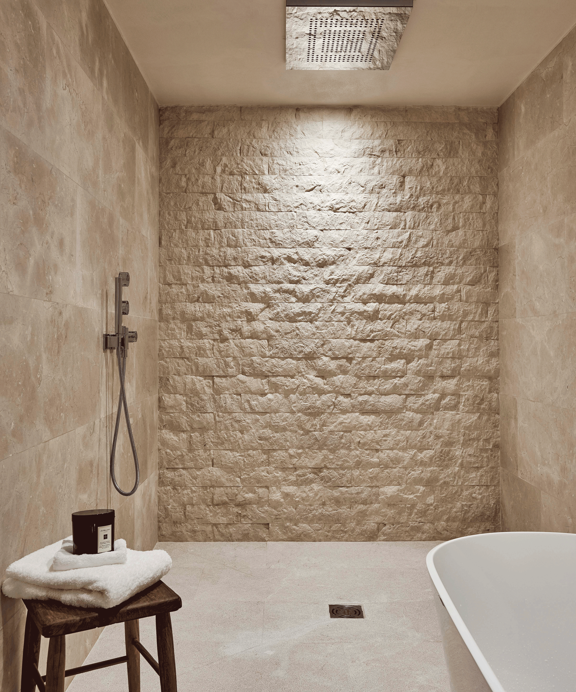Wet room with brick wall focal point