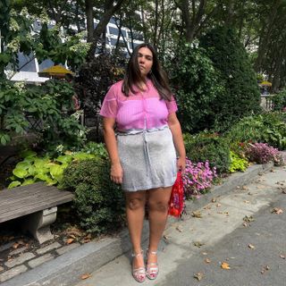 Editor Ana Escalante in pink top and silver skirt.