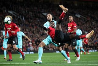 Paul Pogba attempts an overhead kick against Newcastle