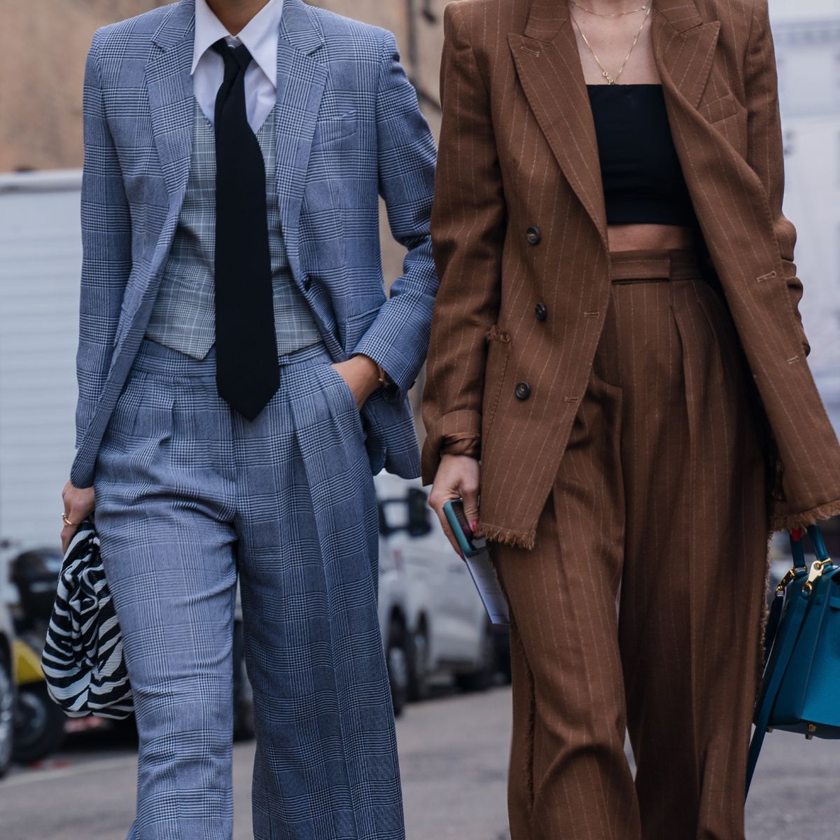 Milan, Italy - 20 February 2020: Stylish persons are posing for photographers before Max Mara fashion show on Milan Woman's Fashion Week F/W2020-2021, street style - stock photo