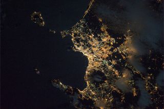 Naples and the volcano Vesuvius as seen from International Space Station at night. Italian astronaut Paolo Nespoli snapped this photo on Dec. 24, 2010.