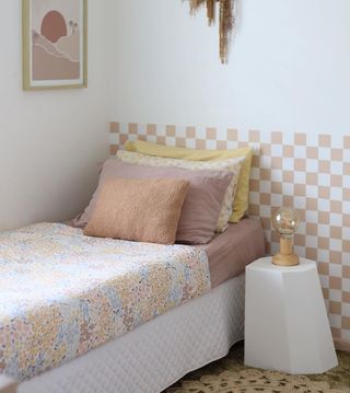 checkerboard walls behind a bed