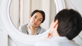 Woman looking in the mirror