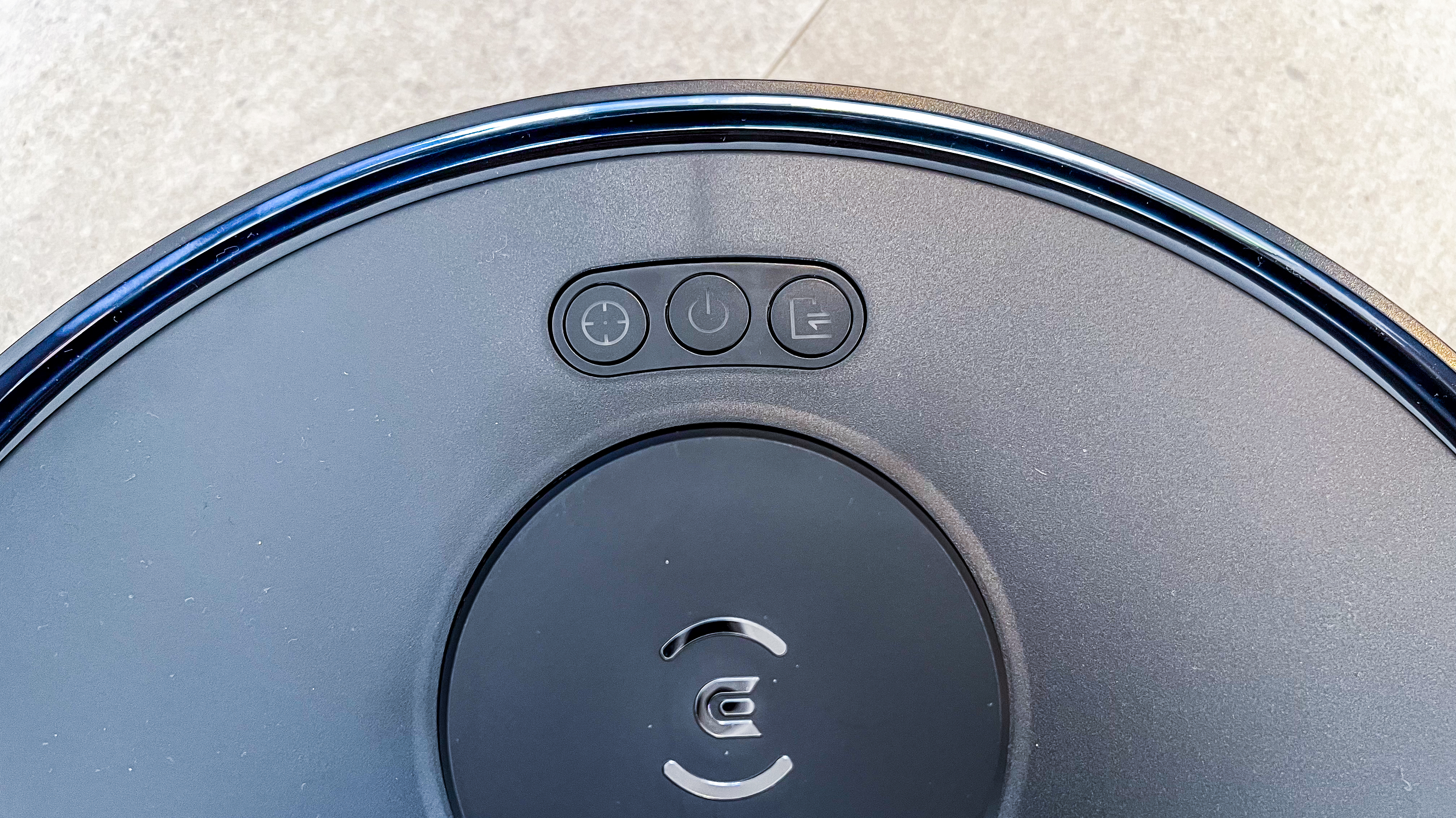 The three control buttons on the top of the Ecovacs Deebot T30 Omni robot vacuum