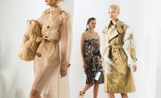1 Model wore transparent jacket and holding one pillow, 1 model wore jacket with feathers, 1 model wore dress with tag