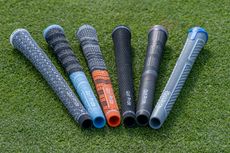 Golf Pride grips laid out on the grass