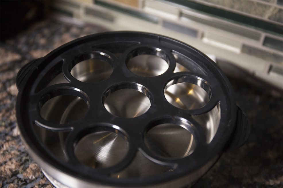 The Cuisinart CEC-10 lets you cook seven eggs on the bottom tray and add another tray if you want to cook three more.
