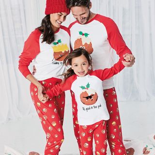family with matching t-shirt and matching pudding pyjamas