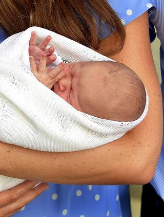 Kate Middleton holding her new baby son