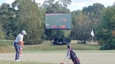 A big screen beside the green at the Golf Club of Georgia Collegiate