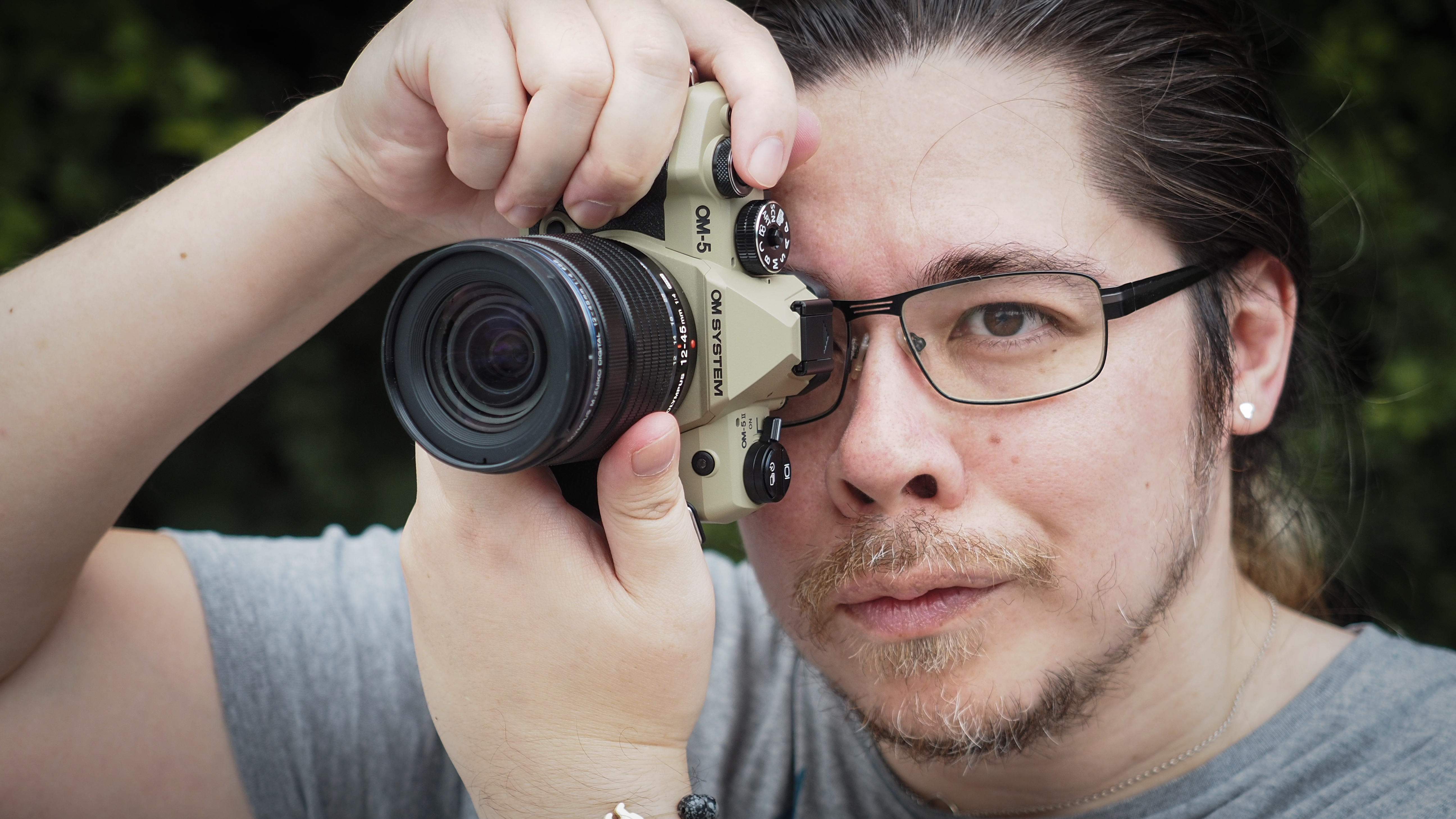 Photographer James Artaius using the OM System OM-5 Mark II
