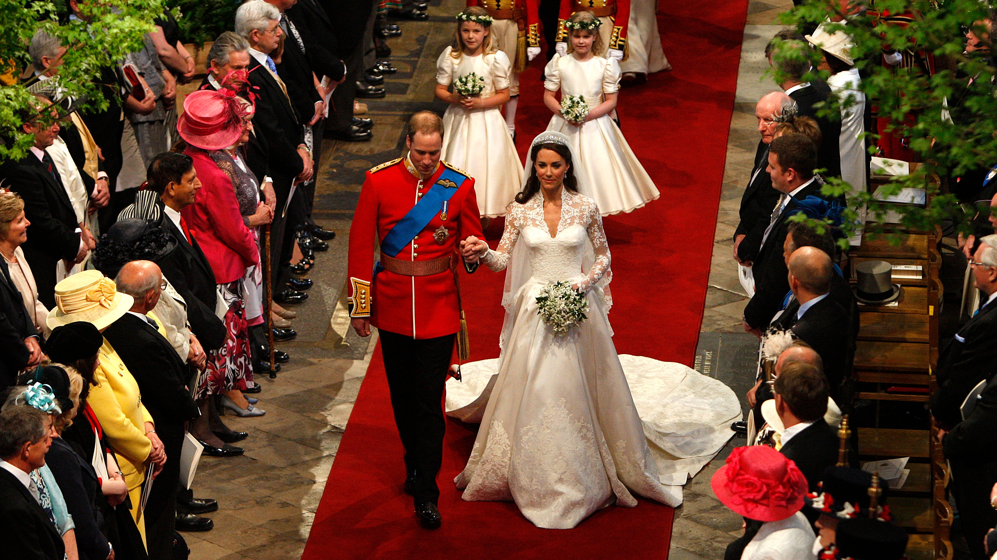 Prince William and Catherine, Princess of Wales walk down the aisle at the end of their wedding ceremony at Westminster Abbey on April 29, 2011