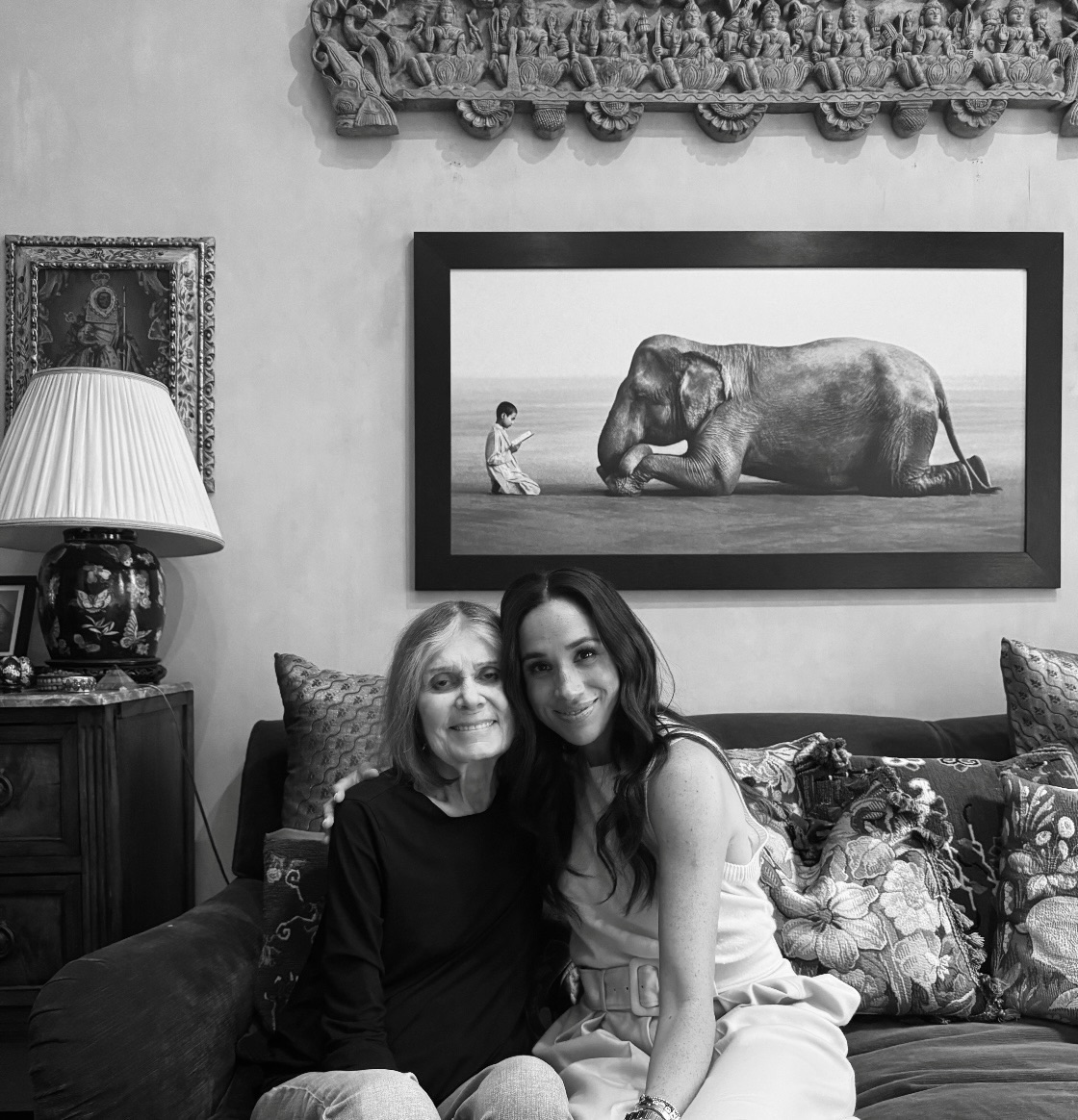Meghan and Gloria Steinem sitting on a sofa