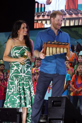 Meghan Markle wearing a green and white drop-waist dress in Colombia August 2024