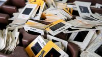 Kodak slides rest on a table at the Winchester Swap Shop at the Winchester Transfer Station in Winchester, MA on June 15, 2019. (Photo by Craig F. Walker/The Boston Globe via Getty Images)