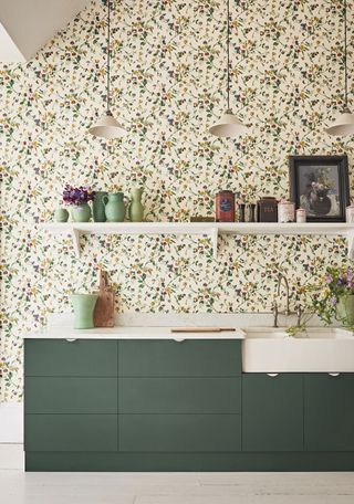 kitchen with floral wallpaper and sink