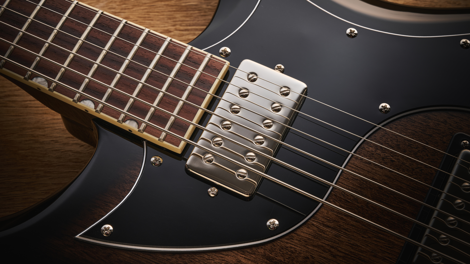 Gretsch Electromatic CVT Baritone in Bristol Fog brown sunburst finish shot on wood.