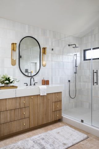 A bathroom with a fluted bathroom vanity and shower