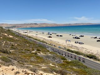 Peloton led by Picnic PostNL races by Aldinga Beach