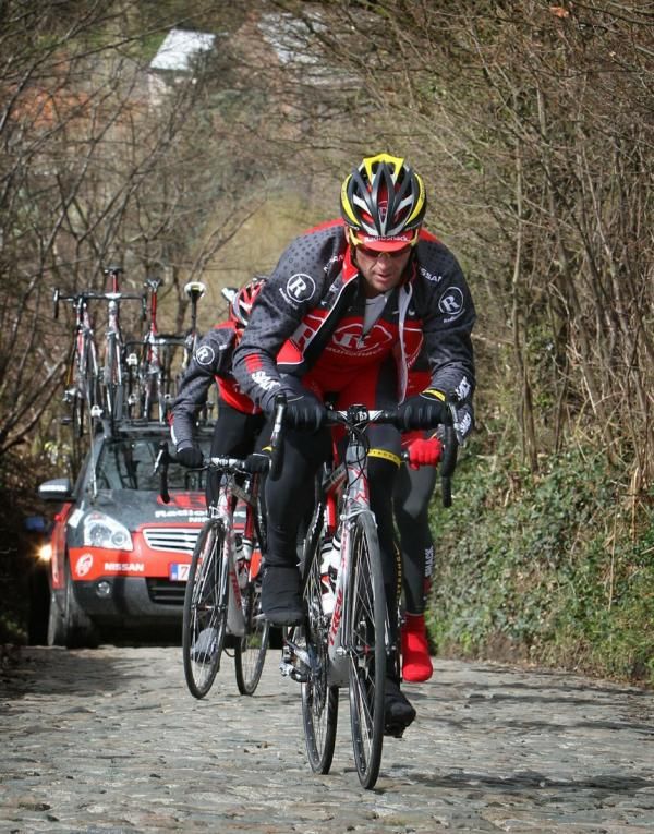 Former Tour de France champion Lance Armstrong rides the Koppenberg with his team-mates.