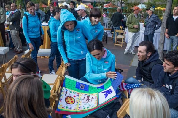Diadora-Pasta Zara riders enjoying paintings given to them by local school children.