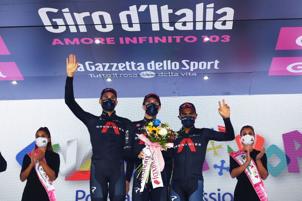 TORTORETO ITALY OCTOBER 13 Podium Filippo Ganna of Italy and Team INEOS Grenadiers Salvatore Puccio of Italy and Team INEOS Grenadiers Jhonnatan Prado Narvaez of Ecuador and Team INEOS Grenadiers Superteam Celebration Flowers Miss Hostess during the 103rd Giro dItalia 2020 Stage 10 a 177km stage from Lanciano to Tortoreto girodiitalia Giro on October 13 2020 in Tortoreto Italy Photo by Tim de WaeleGetty Images