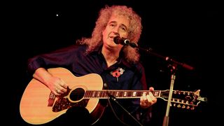 Brian May playing a Guild Jumbo 12-string acoustic