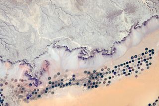 Crew aboard the space station see mysterious circles in the deserts of the Arabian Peninsula. The Smithsonian Channel visits Jordan to reveal the innovation these shapes represent.