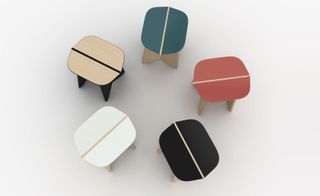 View from above of five O CÉU ‘Cantina’ stools in white, black, red, deep teal and light wood colours