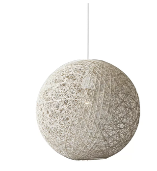 A globe lighting piece made in rattan