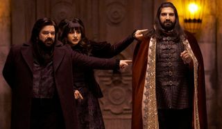 What We Do In The Shadows Laszlo and Nadja pointing Nandor out in a room