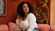 Justina Blakeney sat on a couch