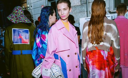 Awash with neon and pastel tones, the youthful and energetic offering featured distressed knitwear in tie-dye