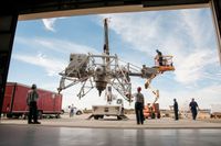 Workers move NASA’s Lunar Landing Research Vehicle (LLRV) into the Air Force Flight Test Museum in California.