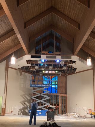 A large speaker/screen/air duct chase previously blocked the church’s “stunning” stained glass window. During the sanctuary renovation, it was removed and the window was returned to its original glory.