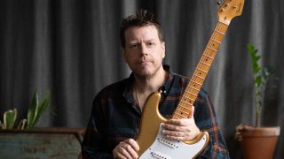 Danny Bryant holding a guitar