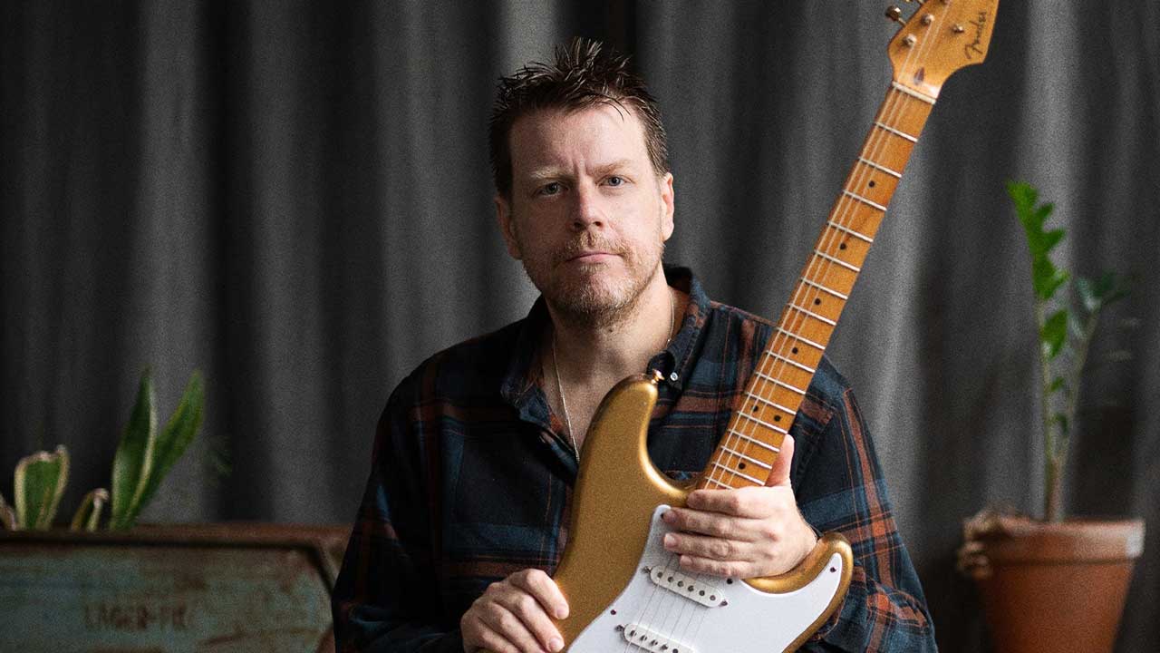 Danny Bryant holding a guitar