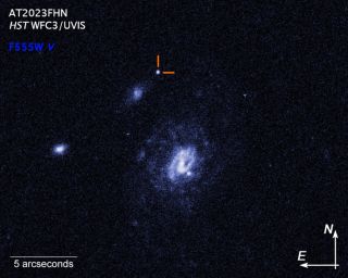 The Hubble Space Telescope's image of the Finch and its location near two galaxies.