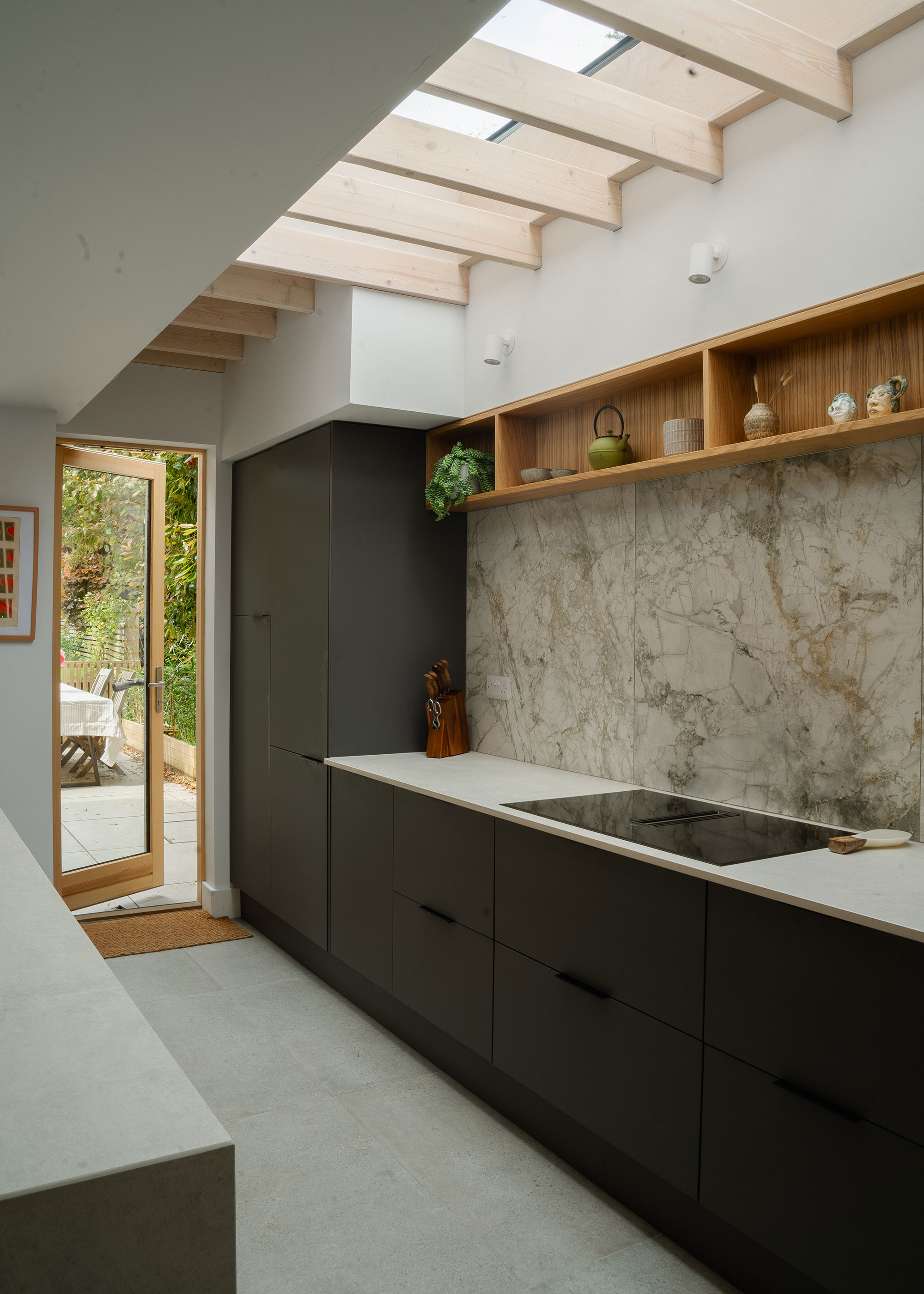 modern grey kitchen with full height marble splashback and internal brise soleil