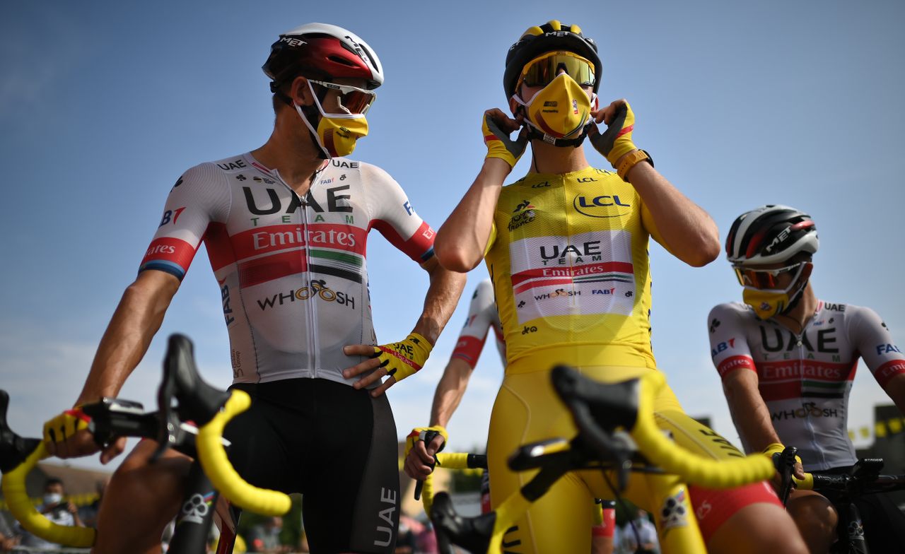 Team UAE Emirates rider Slovenias Tadej Pogacar wearing the overall leaders yellow jersey and his teammates wait prior to the 21st and last stage of the 107th edition of the Tour de France cycling race 122 km between ManteslaJolie and Champs Elysees Paris on September 20 2020 Photo by Marco BERTORELLO POOL AFP Photo by MARCO BERTORELLOPOOLAFP via Getty Images