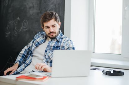 College student thoughtful in study room