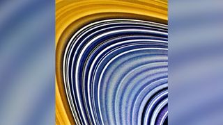 bands of blue, white and orange illustrate the ringlets that make up Saturn's striking ring structure.
